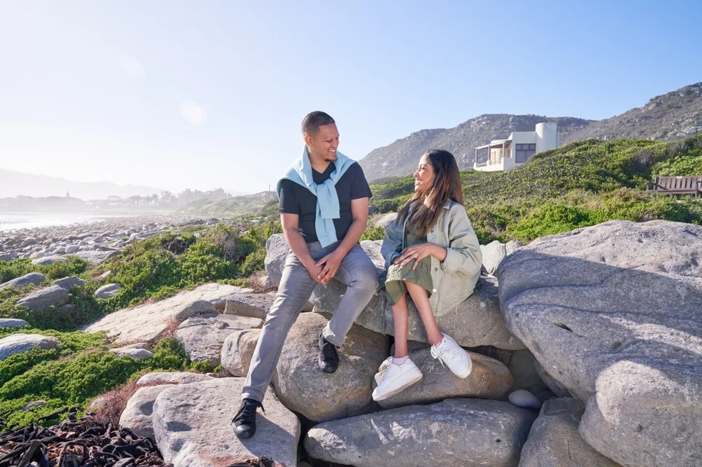 disabled women with carer sitting on a rock in a national park