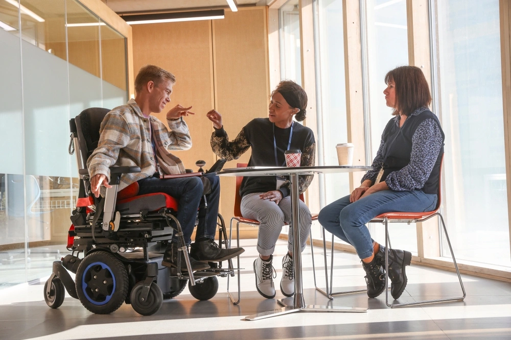 disabled men on wheelchair in a meeting